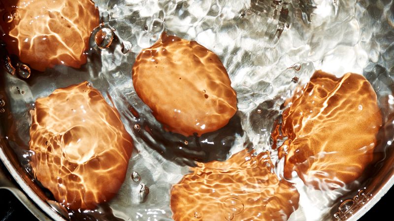 Dropping Eggs into Boiling Water