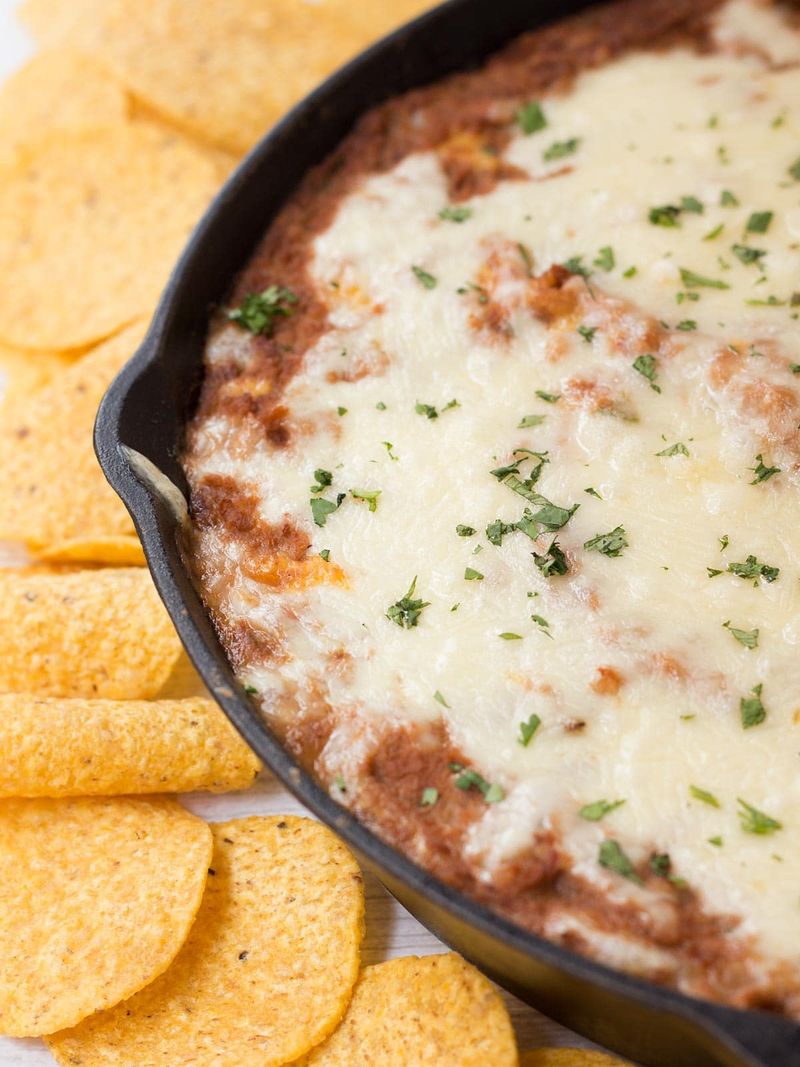 Refried Beans Topped with Melted Cheese
