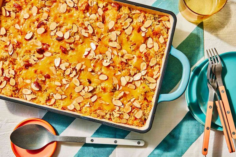 Cheesy Chicken And Wild Rice Casserole Topped With Toasted Almonds