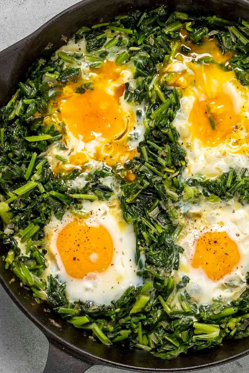 Fried Egg Over Sautéed Spinach And Garlic