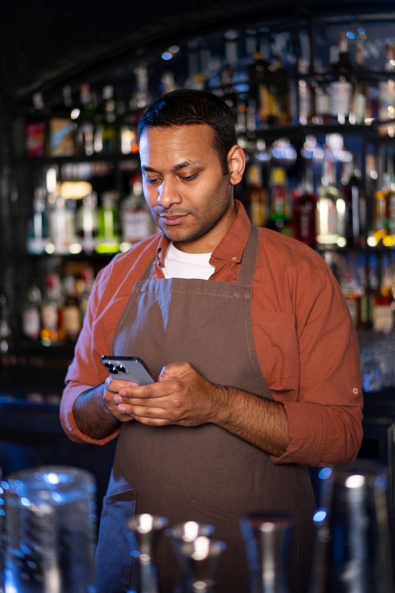 Distracted Phone-Focused Bartenders
