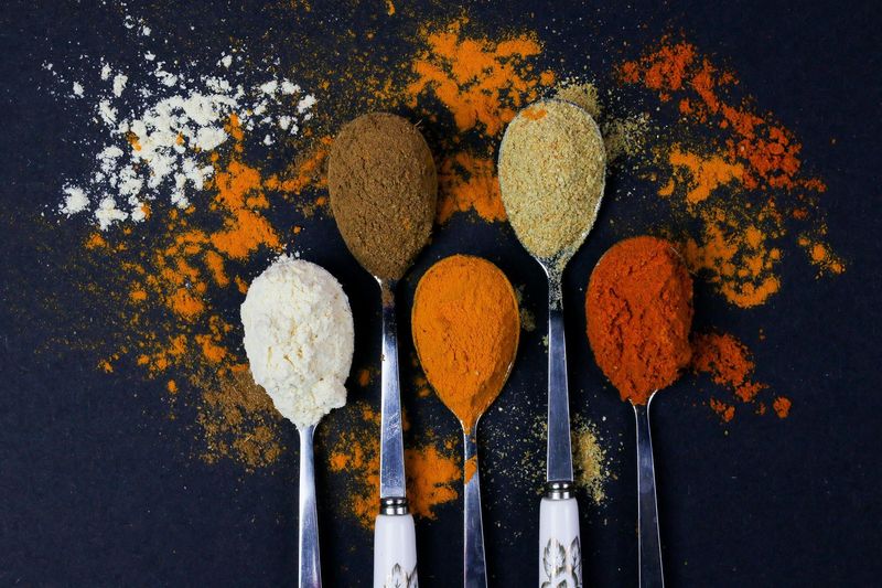 Spice Jars Containing Sawdust and Food Coloring
